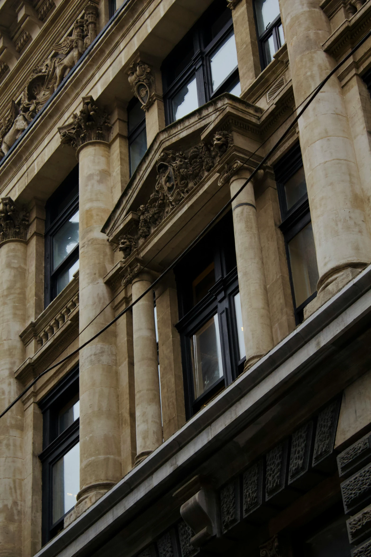 an old building has a clock on the front