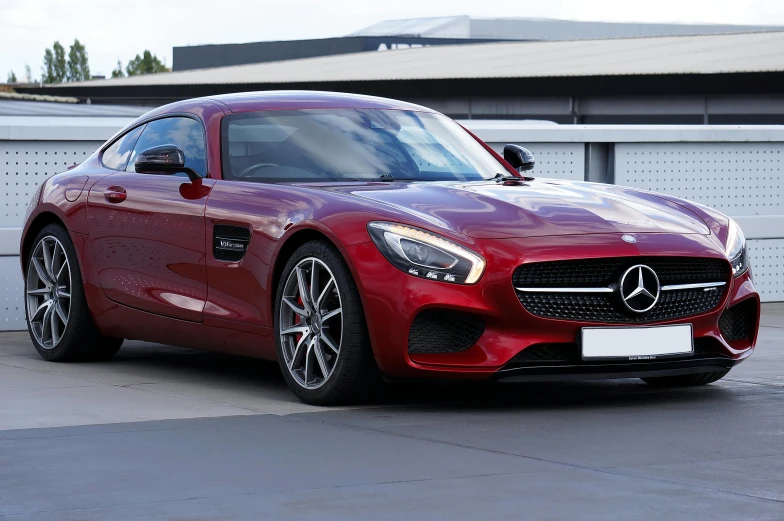 a mercedes benz sports car is parked in the driveway