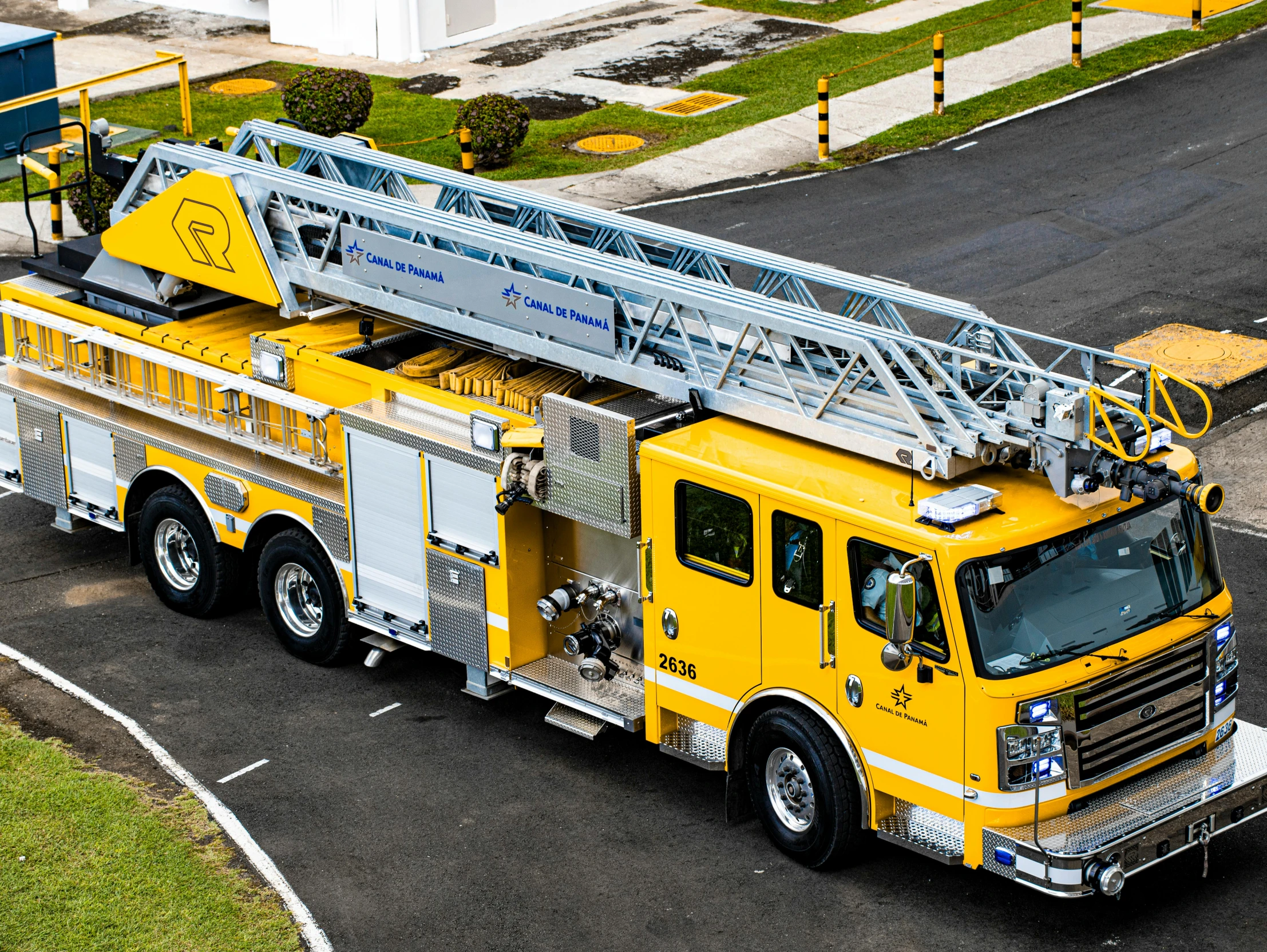 a yellow firetruck with all its lights on