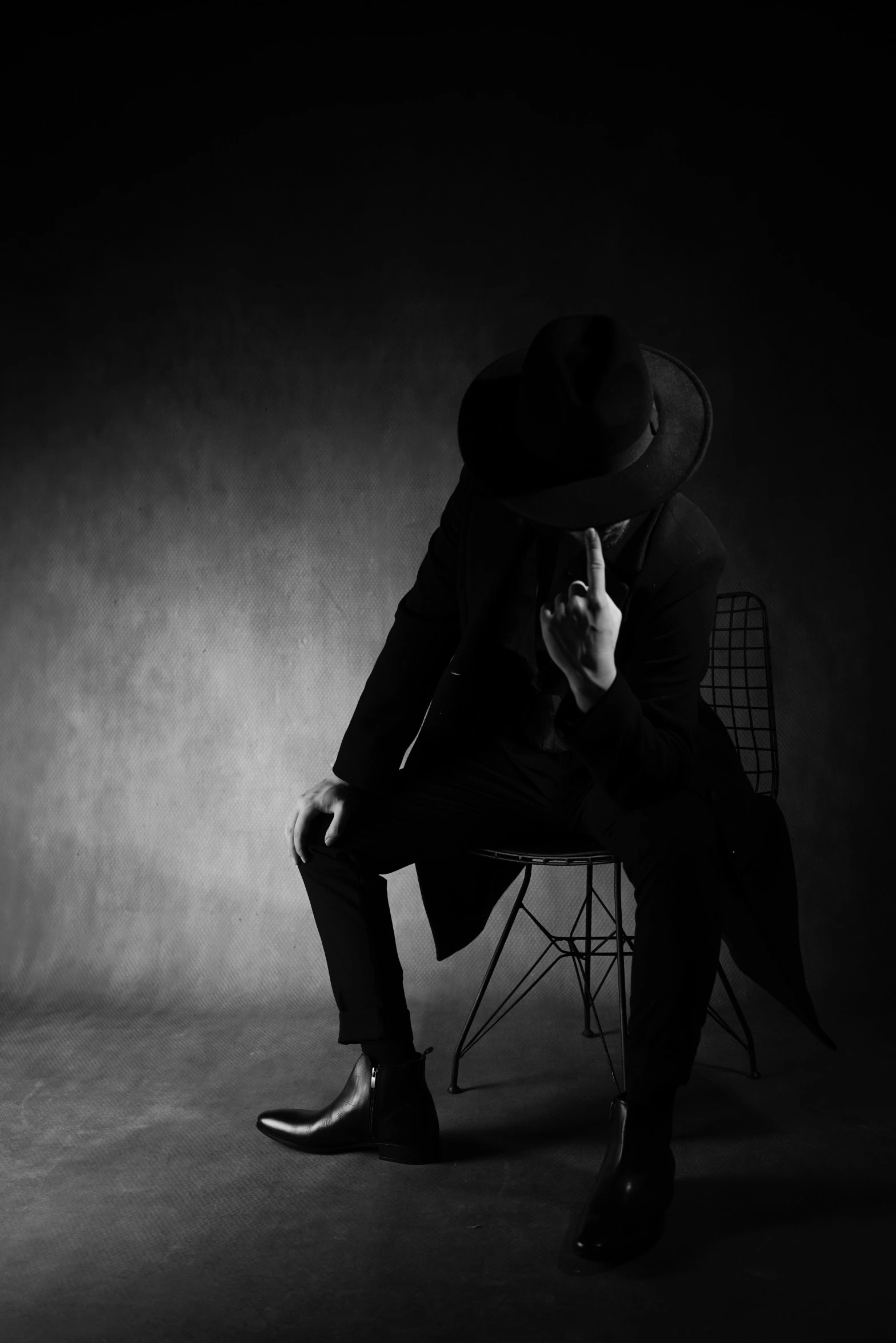 black and white image of a man in a hat