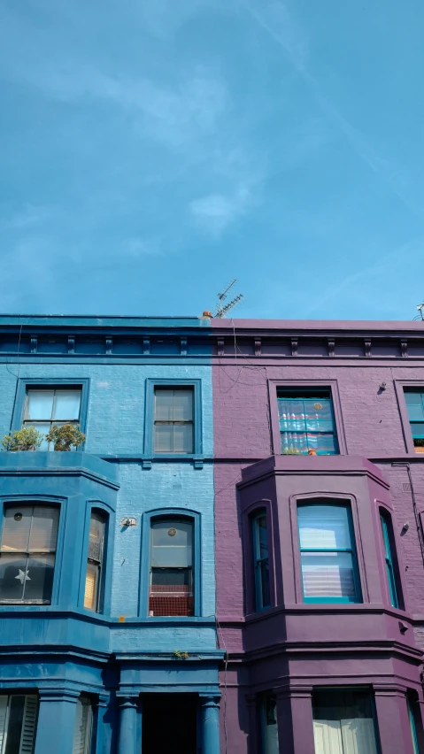 a row of buildings against a blue sky