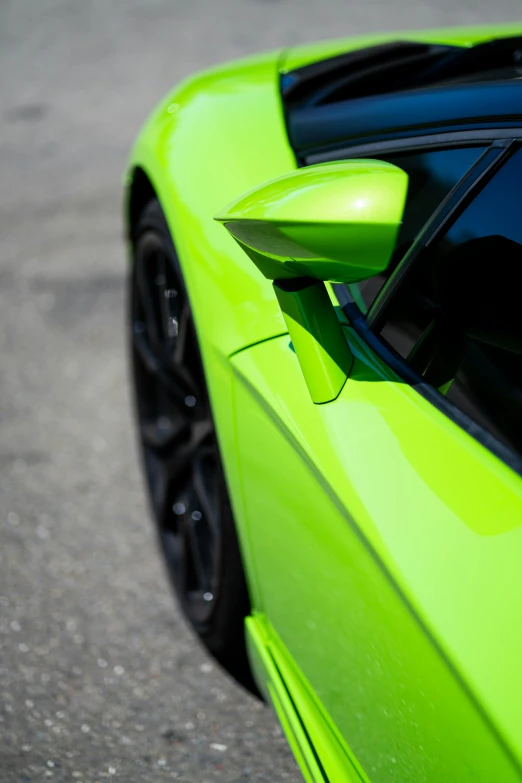 a bright green sports car parked on the street