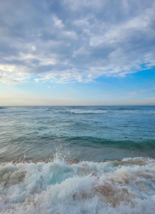 a view of the ocean with rough waves from a surfboard