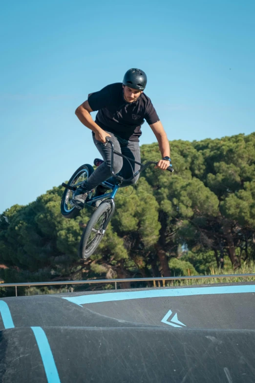 a man doing tricks on his bike in the air