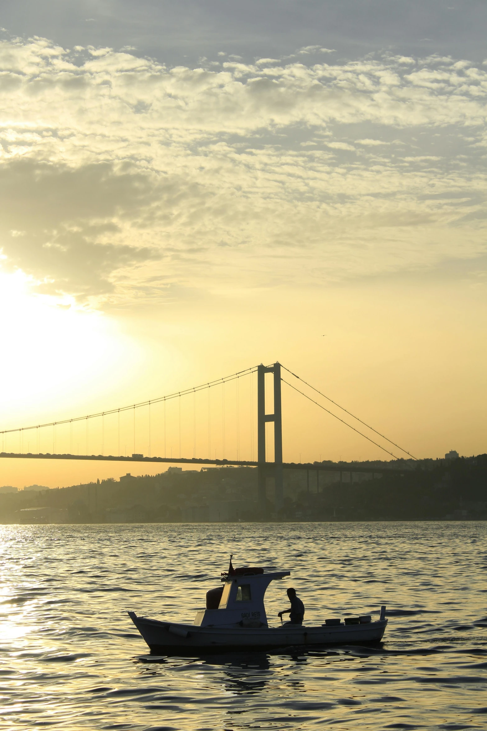 a small boat on the water at sunset