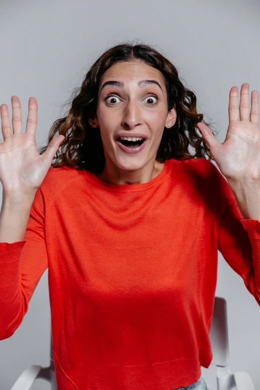 a woman making the cut of herself to look surprised