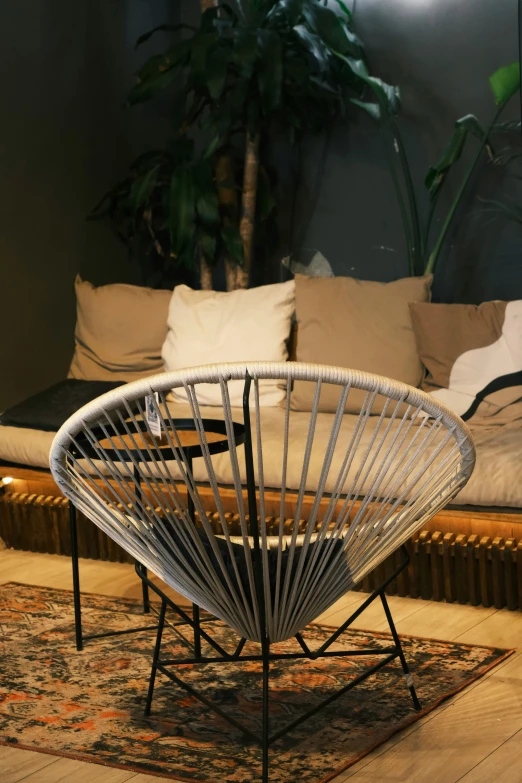 white metal chair in the middle of a room