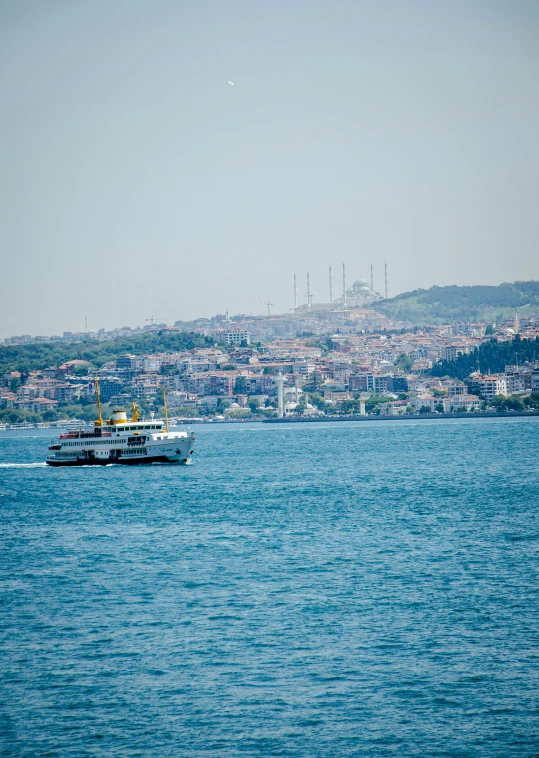 a large boat traveling across a blue ocean