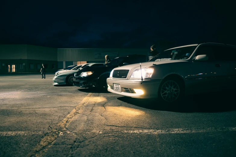 three cars parked next to each other in a parking lot