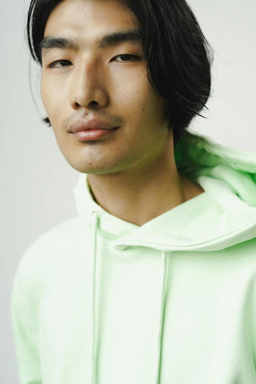 young asian man looking directly in to the camera