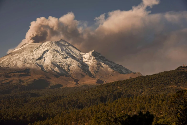 a mountain that is covered with some smoke