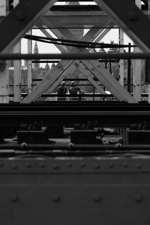 people in black and white pograph at an overpass