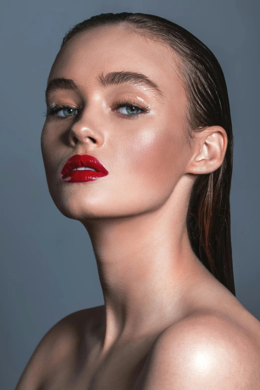 the model has red lipstick and a high bunt