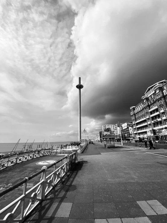 a black and white po of a street near the water