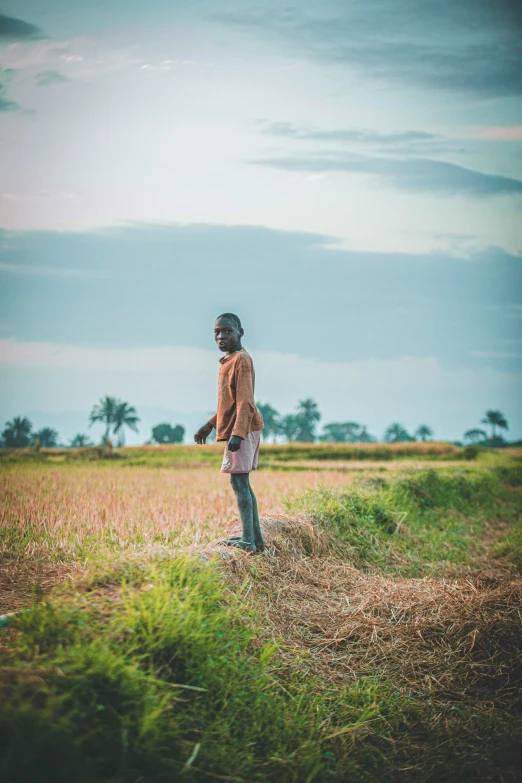 an african american man standing in an open field