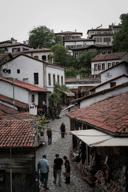 this is an alley way with people walking down it