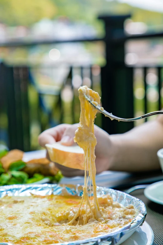 a person is eating food on a plate