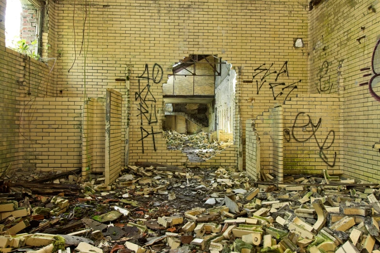 a very old run down brick building with graffiti on the walls