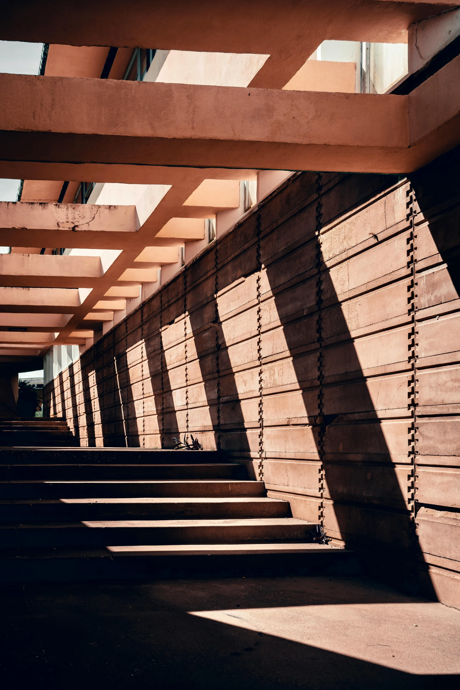 a long stairway going down to the side of a building