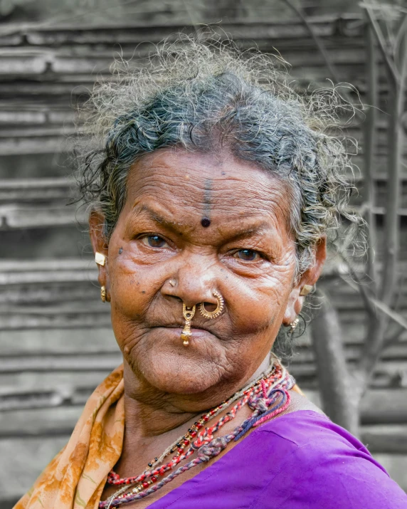 an older woman with black and white hair in an old - fashioned portrait