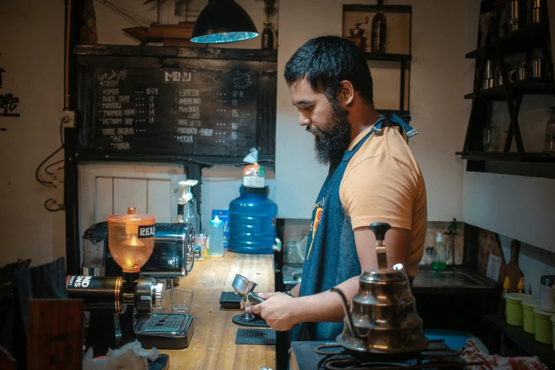 a person standing over a counter with a plate of food