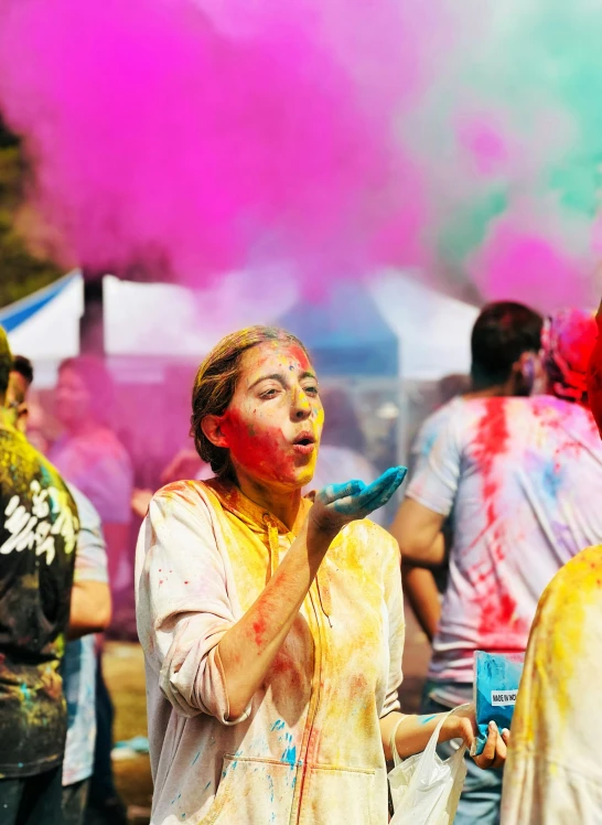 woman covered in white shirt and colorful paint