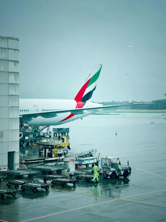 a very large plane sitting by the terminal