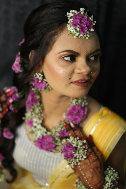 this is an attractive woman with flowers in her hair