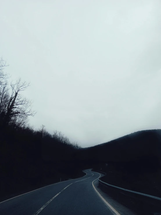 an image of a long country road during the day