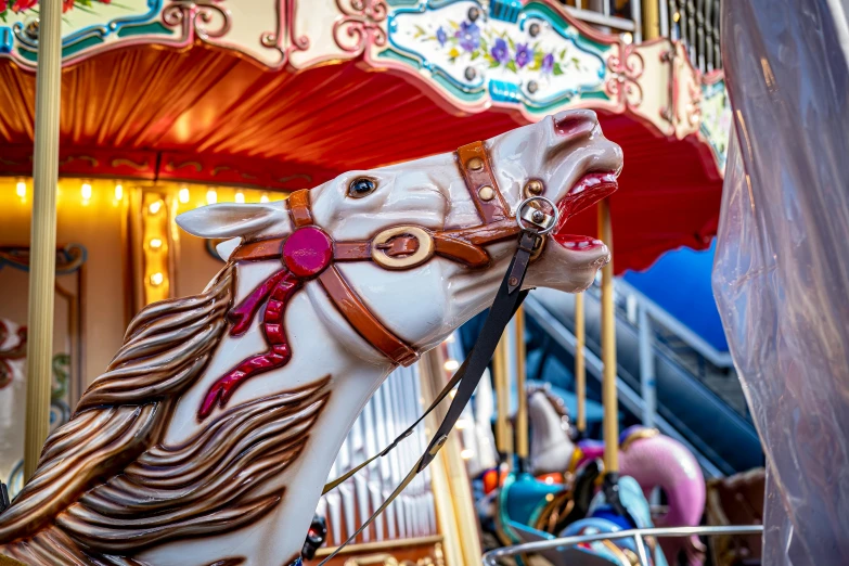 a white horse with a red and pink mane