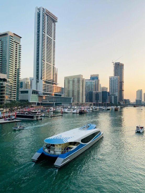 a group of boats on the water in a city