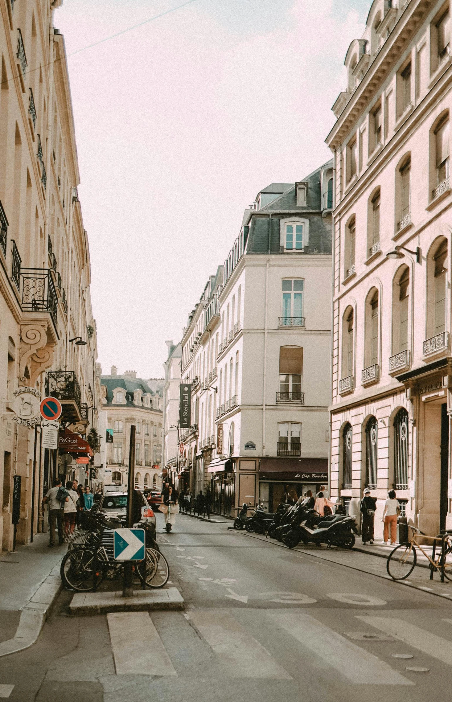 a large empty street with bicycles parked on the side walk