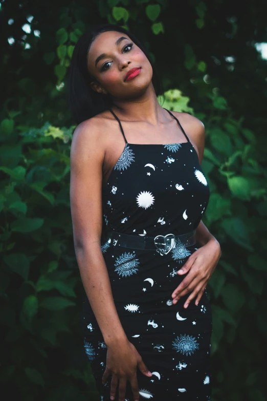 a woman in a dress is staring into the distance