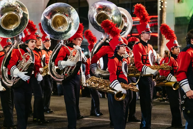 a group of men in red and black uniforms