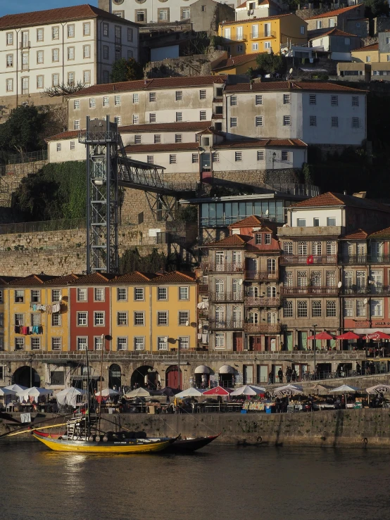 a city with buildings and boats sitting in the water