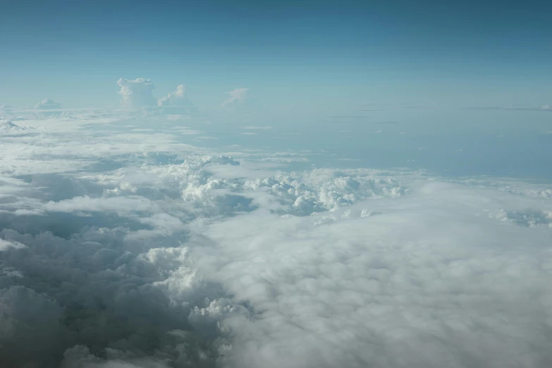 a view of the wing and the clouds from a plane