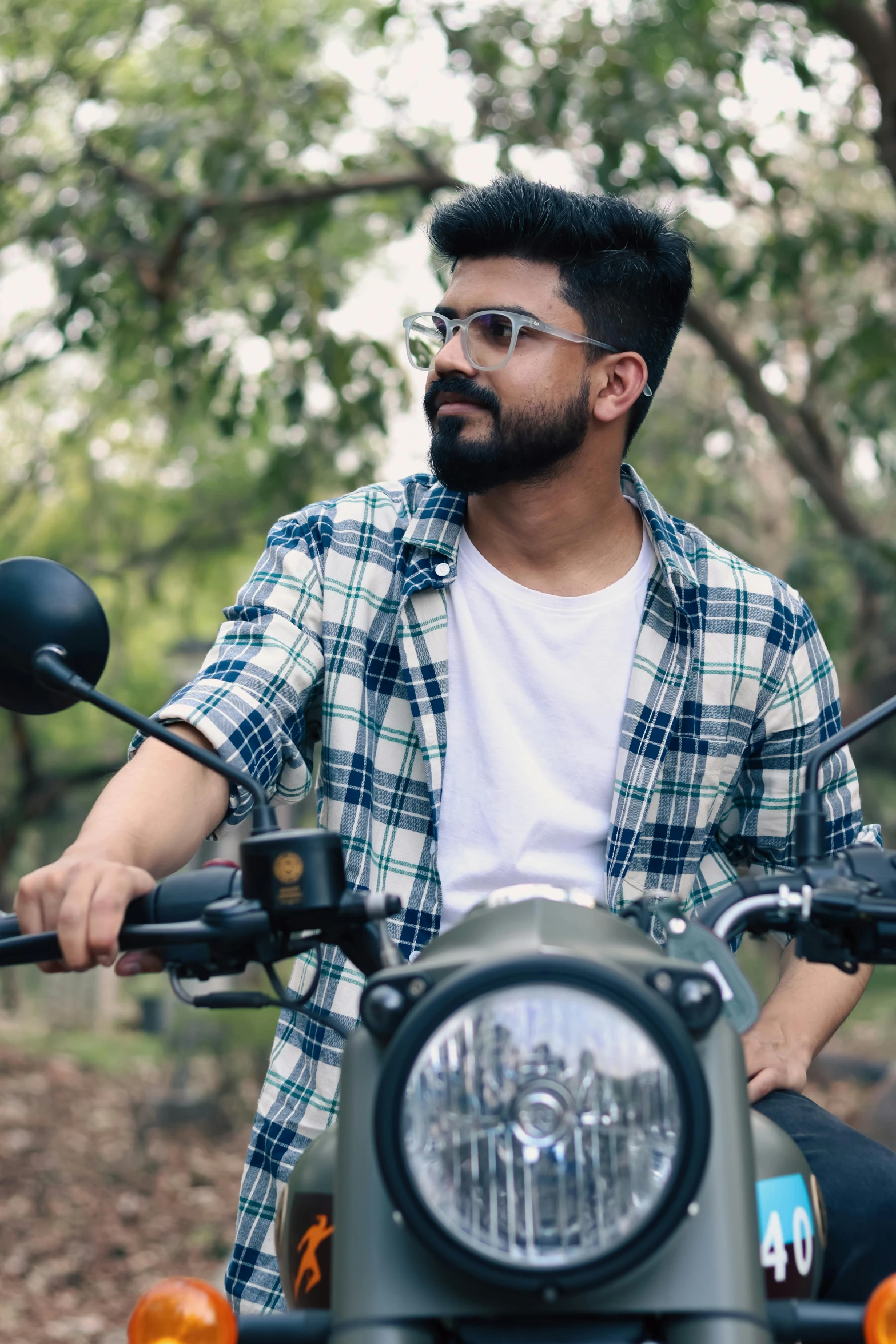 a man sitting on the seat of a motorcycle