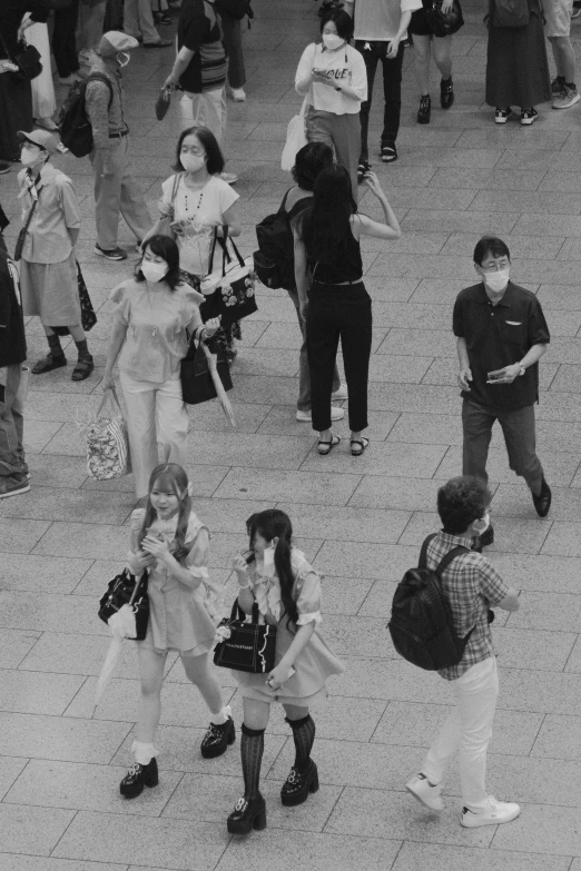 a large group of children in a public area