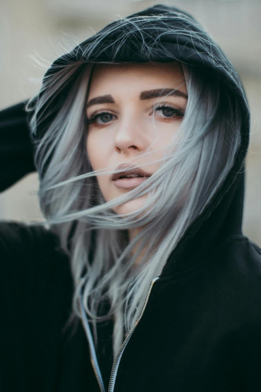 a girl with white hair and black hoodie