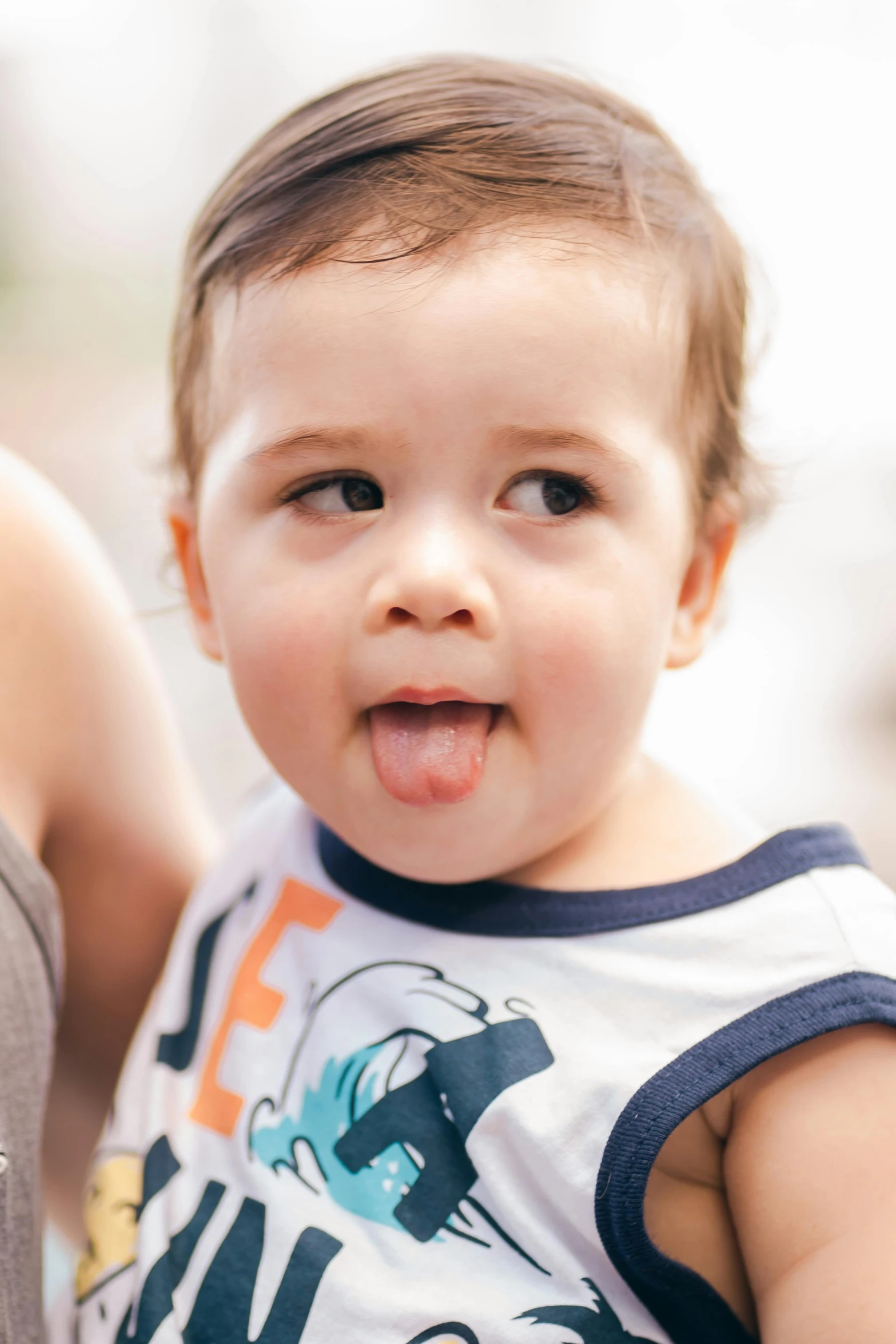 an adorable  sticking his tongue out