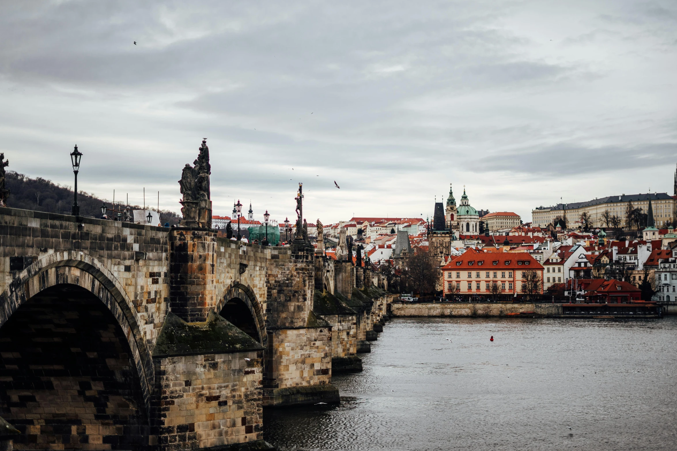 the old stone bridge crosses the river in europe