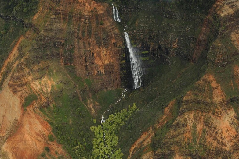 a very big pretty waterfall near some mountains