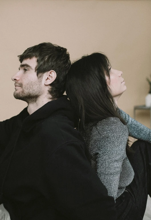 a man and woman are sitting next to each other