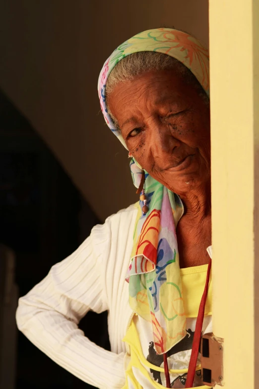 a woman wearing a headscarf with her face peeking out