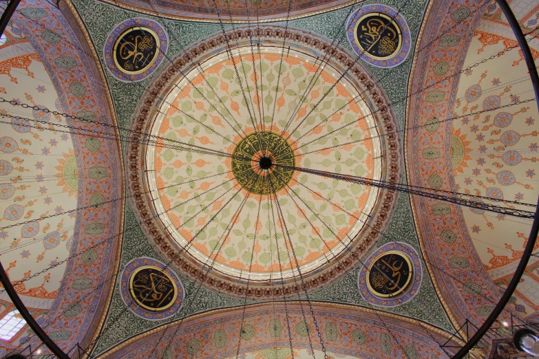 the ceiling of a large round room in an old house