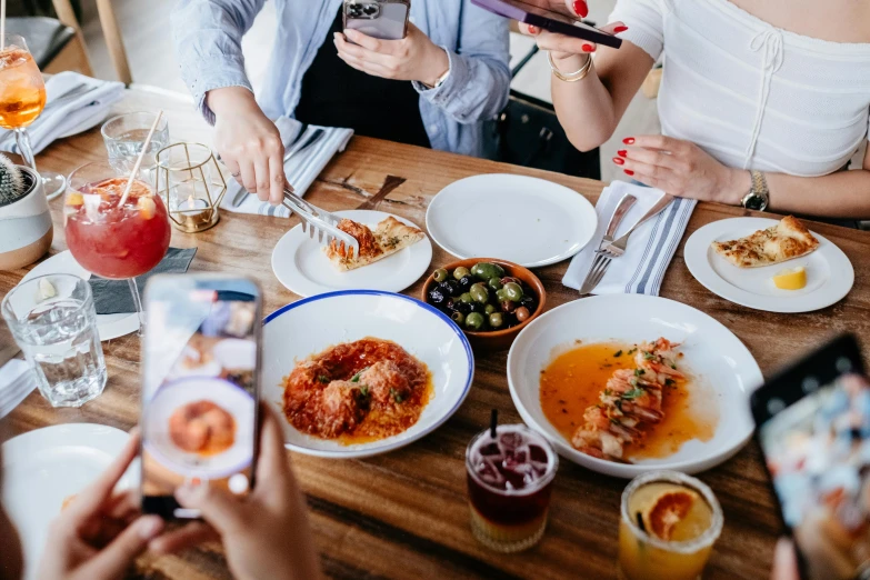 people eating a meal together at a restaurant