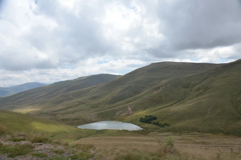 a lake sitting in the middle of some mountains