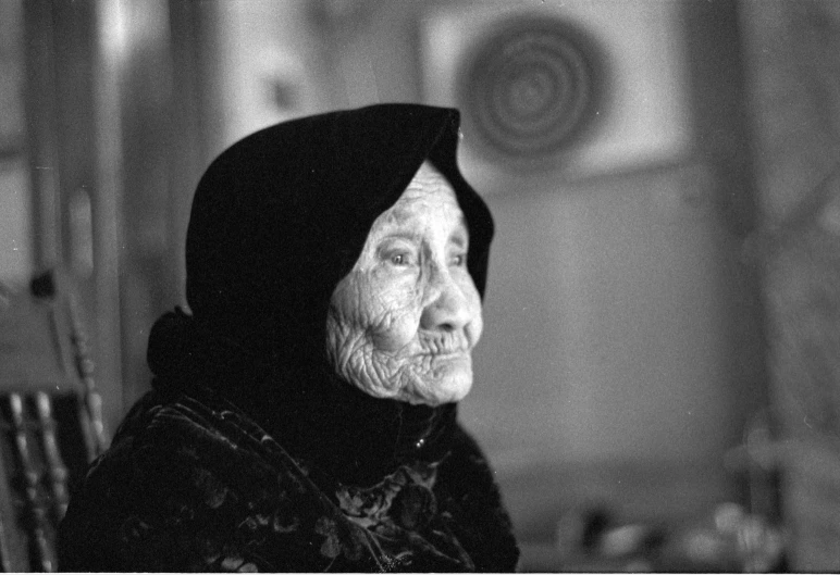 an old woman in a black shawl