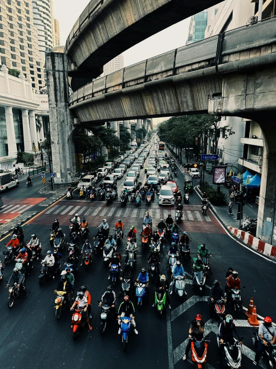 people on motorcycles riding through the street