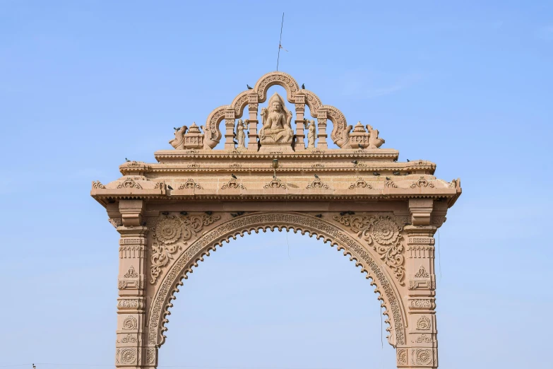 a large beige sculpture in a park